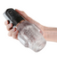 A hand model holds a clear vibrating suction masturbator with a plastic top with the controls on it.