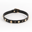 A black faux leather croc choker with alternating floral charms and crystal gems.