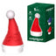 A red and white clitoral vibrator in the shape of a Santa hat with a pompom sits next to its box on a white background.