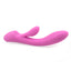 Side view of a light pink silicone rabbit vibrator with a curved G spot shaft laying on its side on a white background.
