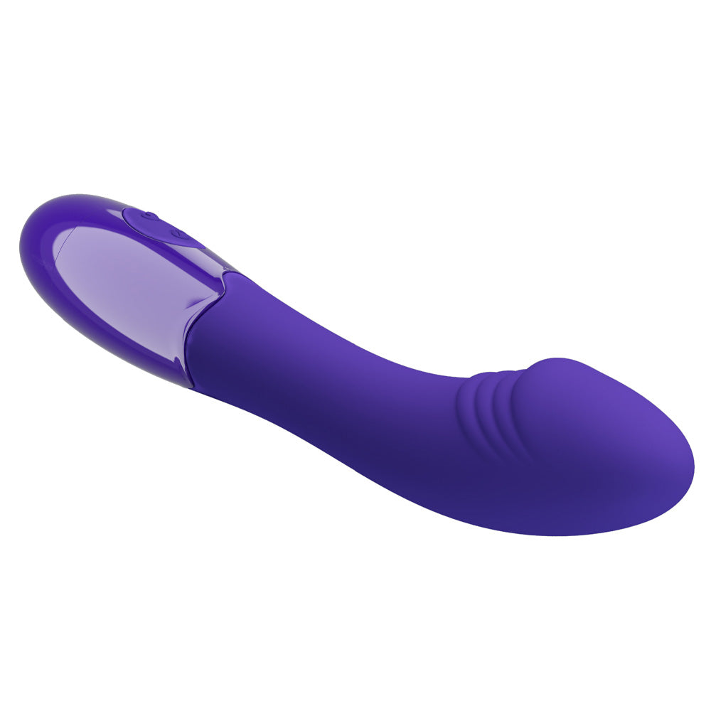 A purple silicone G-spot vibrator lays on a white backdrop and shows its skin-like ridges under its phallic tip.
