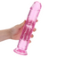 A hand model holds a pink crystal clear jelly that features a veiny shaft texture.  