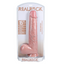 An extra long realistic dildo with balls sits in a clear packaging by Real Rock. 