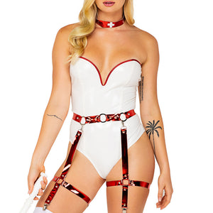 Close up of a model wearing Roma 4 piece naughty nurse vinyl bodysuit in white and metallic red. 