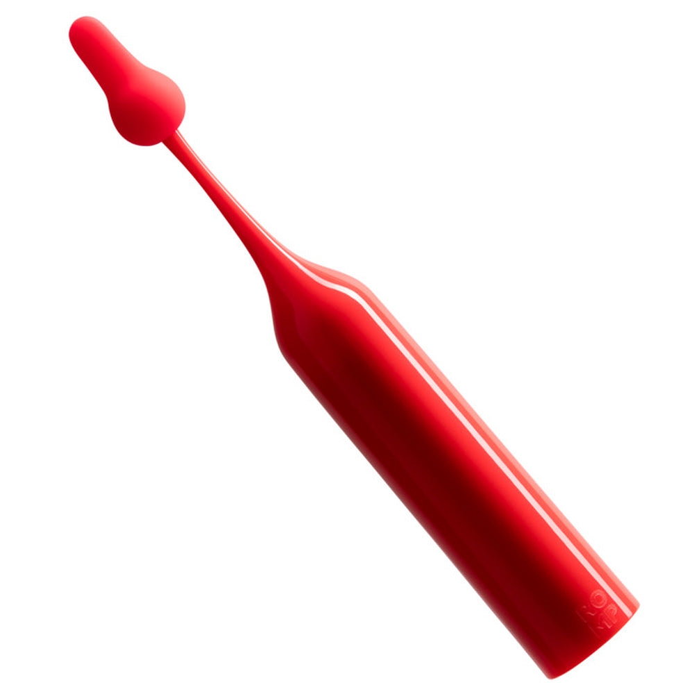 A slim red cylindrical clitoral vibrator with a paddle-shaped attachment sits at an angle against a white backdrop.