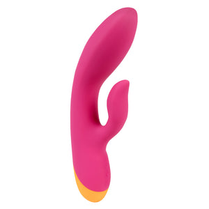 A pink and orange g-spot rabbit vibrator with a flexible head and shaft stands against a white backdrop.