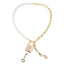A half and half design necklace of pearls and gold chain lays against a white backdrop. 
