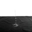 A water droplet falls on a black waterproof blanket.  