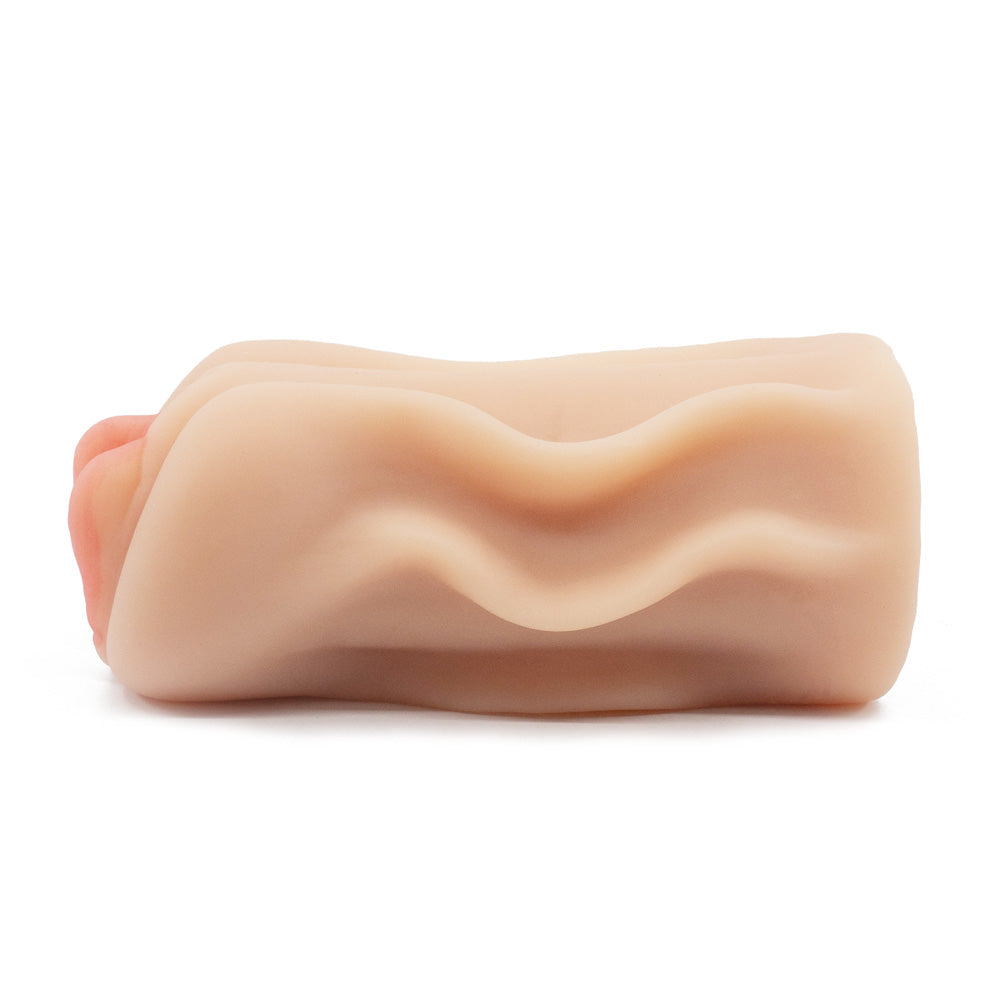 A side view of a realistic pink-lipped pussy stroker with a ribbed texture sits against a white backdrop.