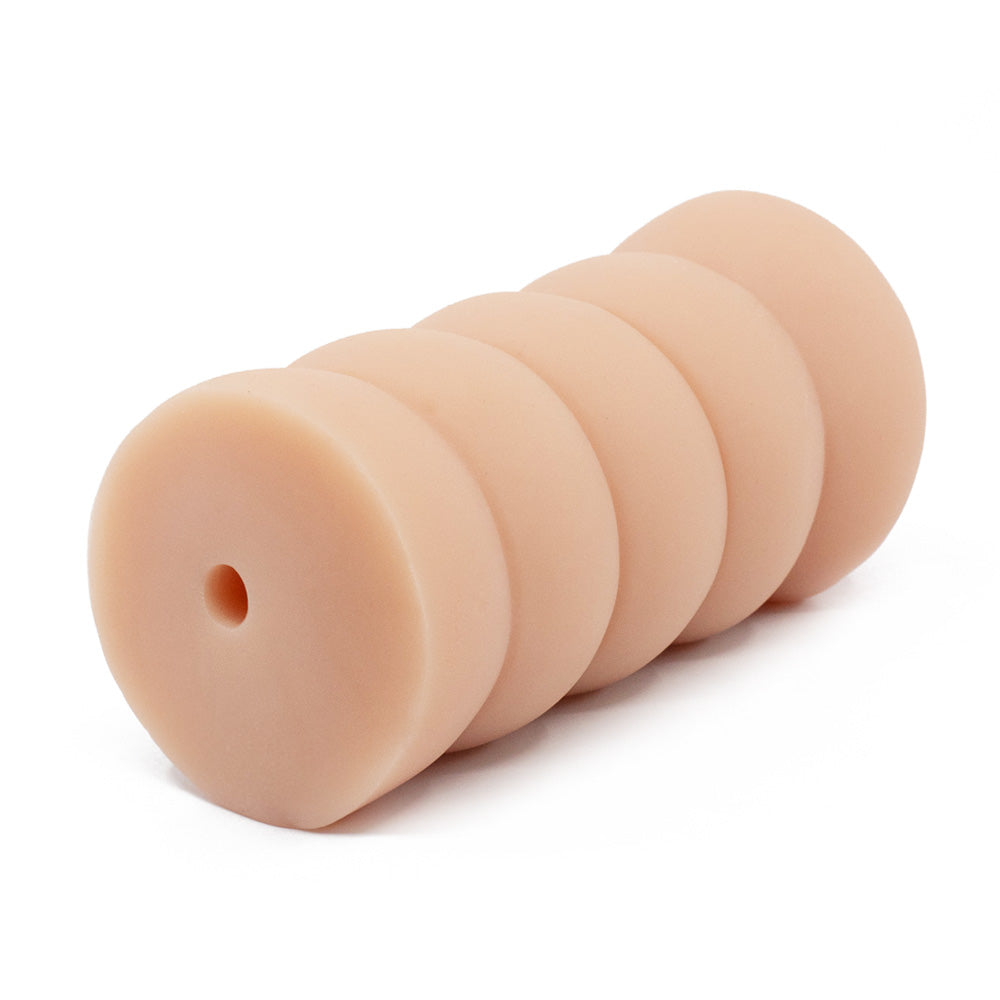 A back view of a realistic pussy stroker with a ribbed texture shows the air hole, which sits against a white backdrop.