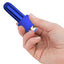 A hand model holds a blue bullet vibrator with a silicone donut ring around the base. 
