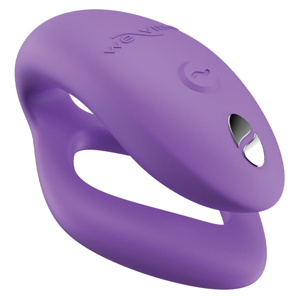 The purple We-Vibe Sync O couples vibrator shows its ergonomic C-shaped design and hollow, squeezable G-spot arm.