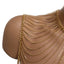 A close up of a gold draped shoulder body chain against a white backdrop worn on a mannequin.