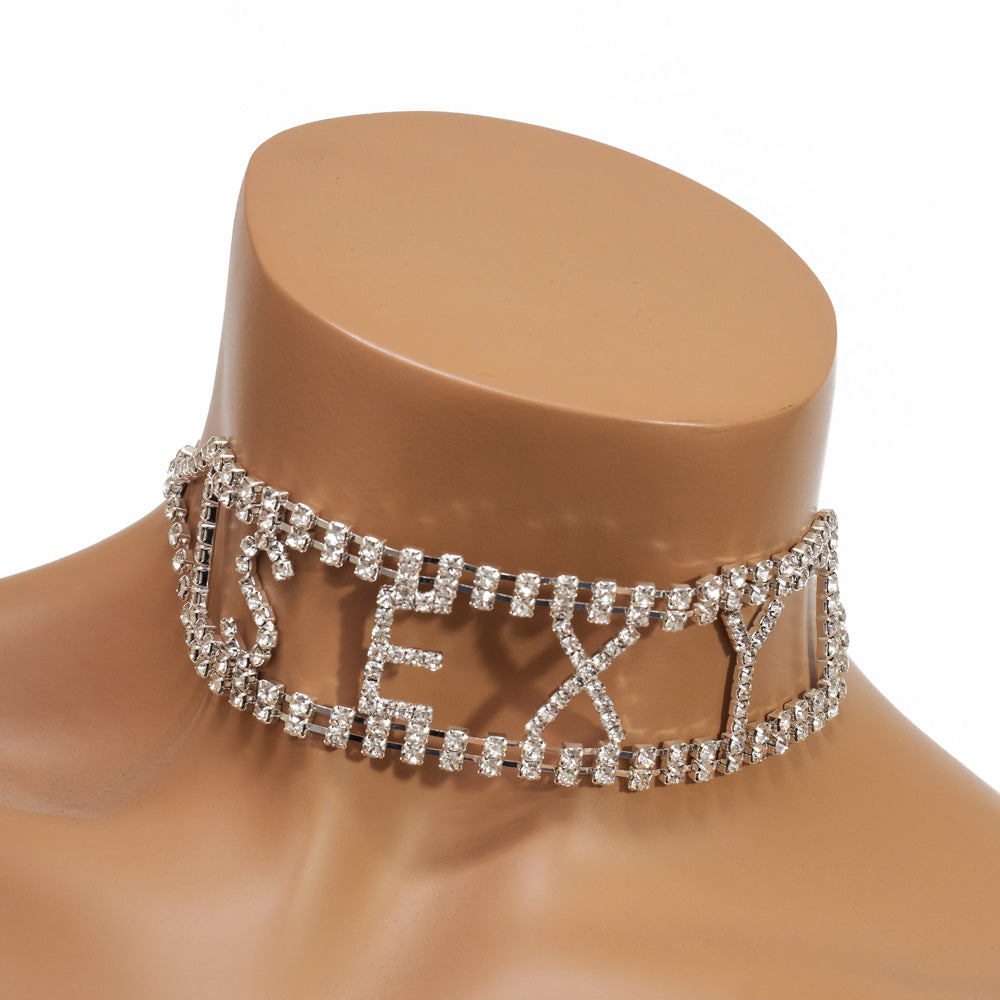 A mannequin wears a silver choker that reads sexy encrusted with diamanté’s.