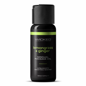 A bottle of sensual massage oil stands on a white backdrop in a lemongrass and ginger scent. 