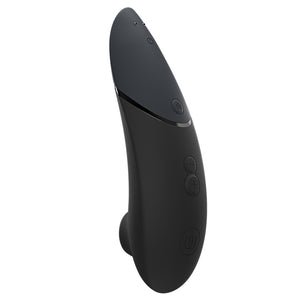A back view of an ergonomically curved Womanizer clitoral stimulator showcasing its control buttons.