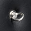 A close up of a silver ring protruding from a padded bondage wall mount. 