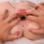 A pair of hands stretch open the vaginal entrance of a life size masturbator to showcase its textured inner tunnel. 