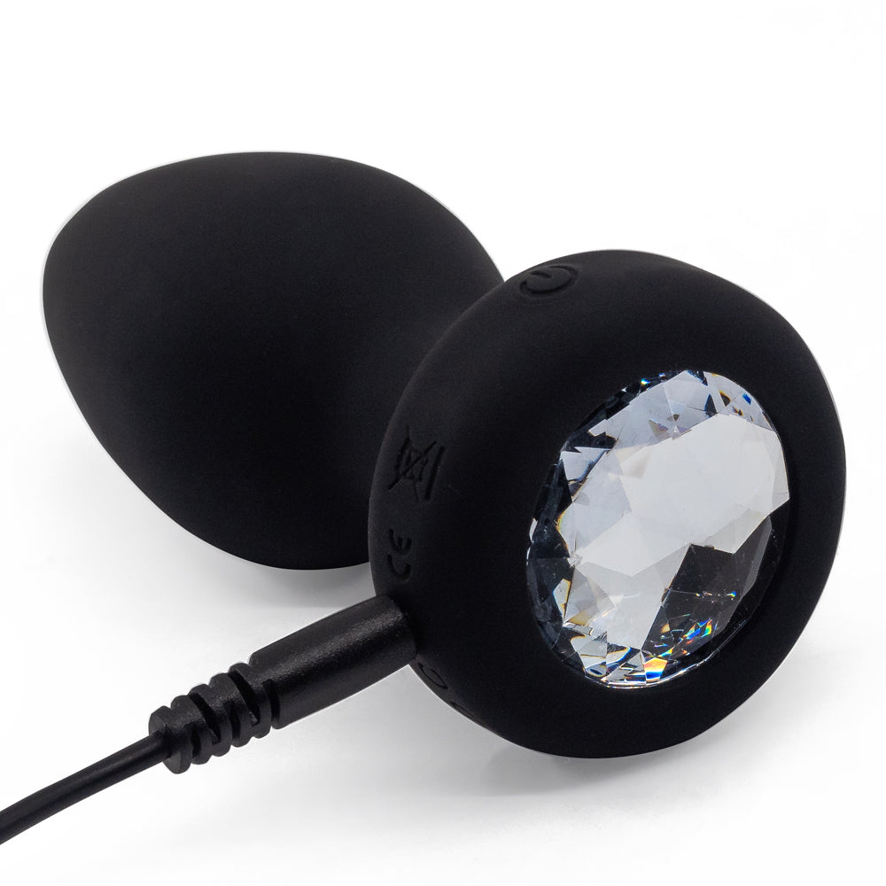  Ashella Vibes Remote Control Vibrating Jewel Butt Plug has a tapered tip + firm neck for easy insertion & has 10 vibration modes you or a partner can control or w/ the remote. USB charging.