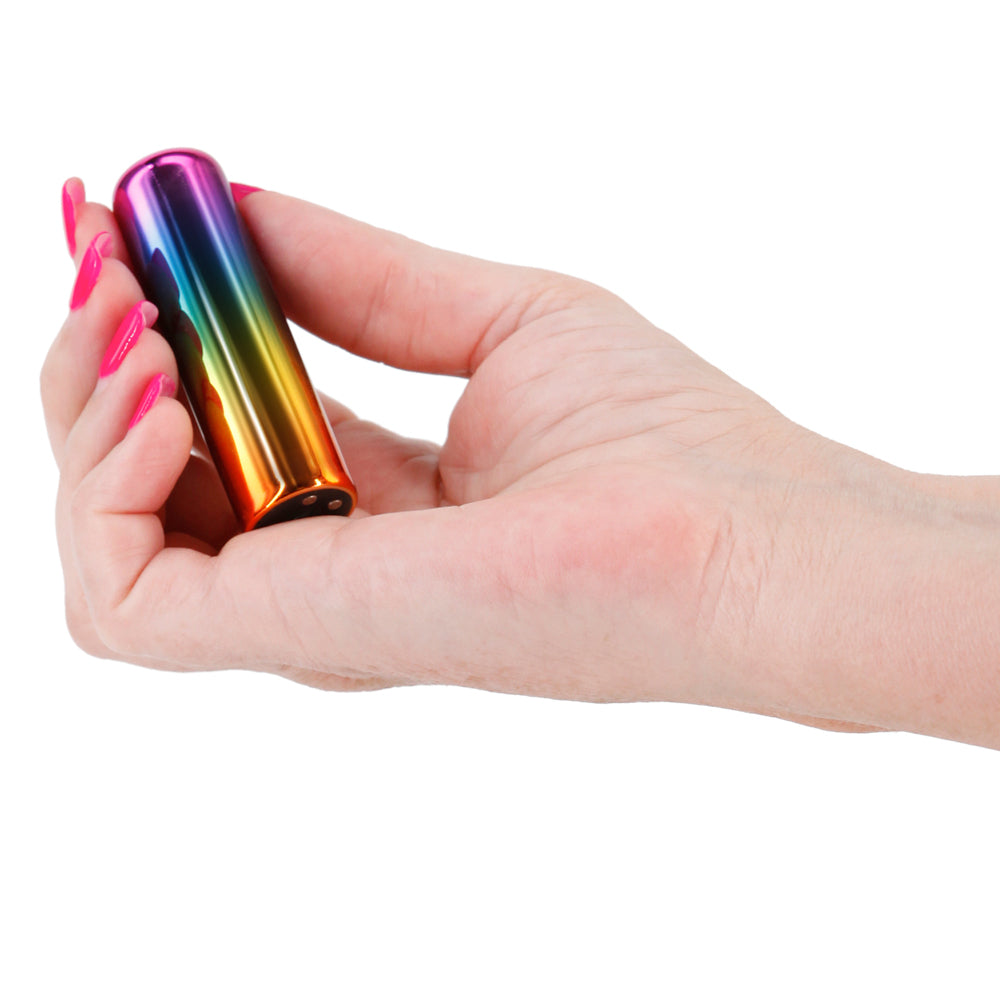 Chroma Rechargeable Metallic Bullet Vibrator x vibration settings in a squared-off metallic body for broad external stimulation. Rainbow. On-hand.