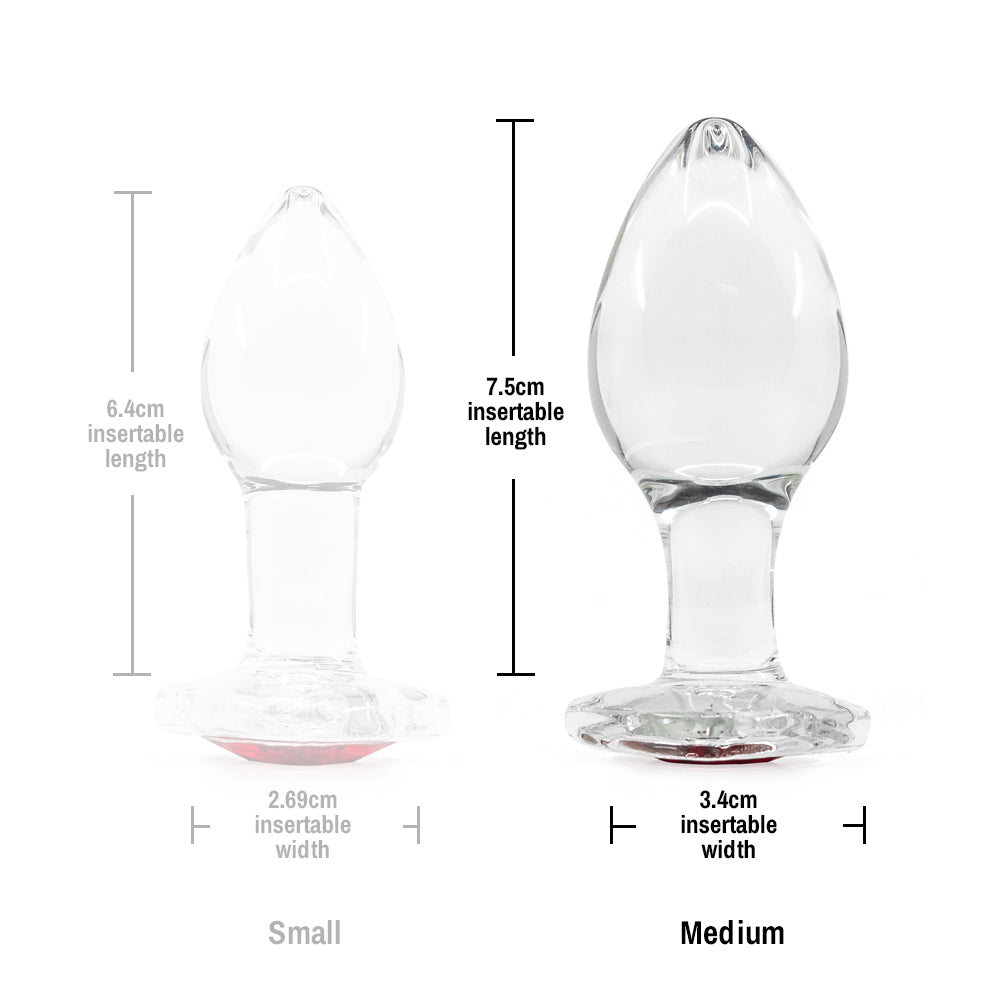 Crystal Desires Glass Butt Plug With Heart Gem - Medium has a red heart-shaped gem base to make your butt look glamorous! Compatible w/ all lubricants & temperature play. Size chart.