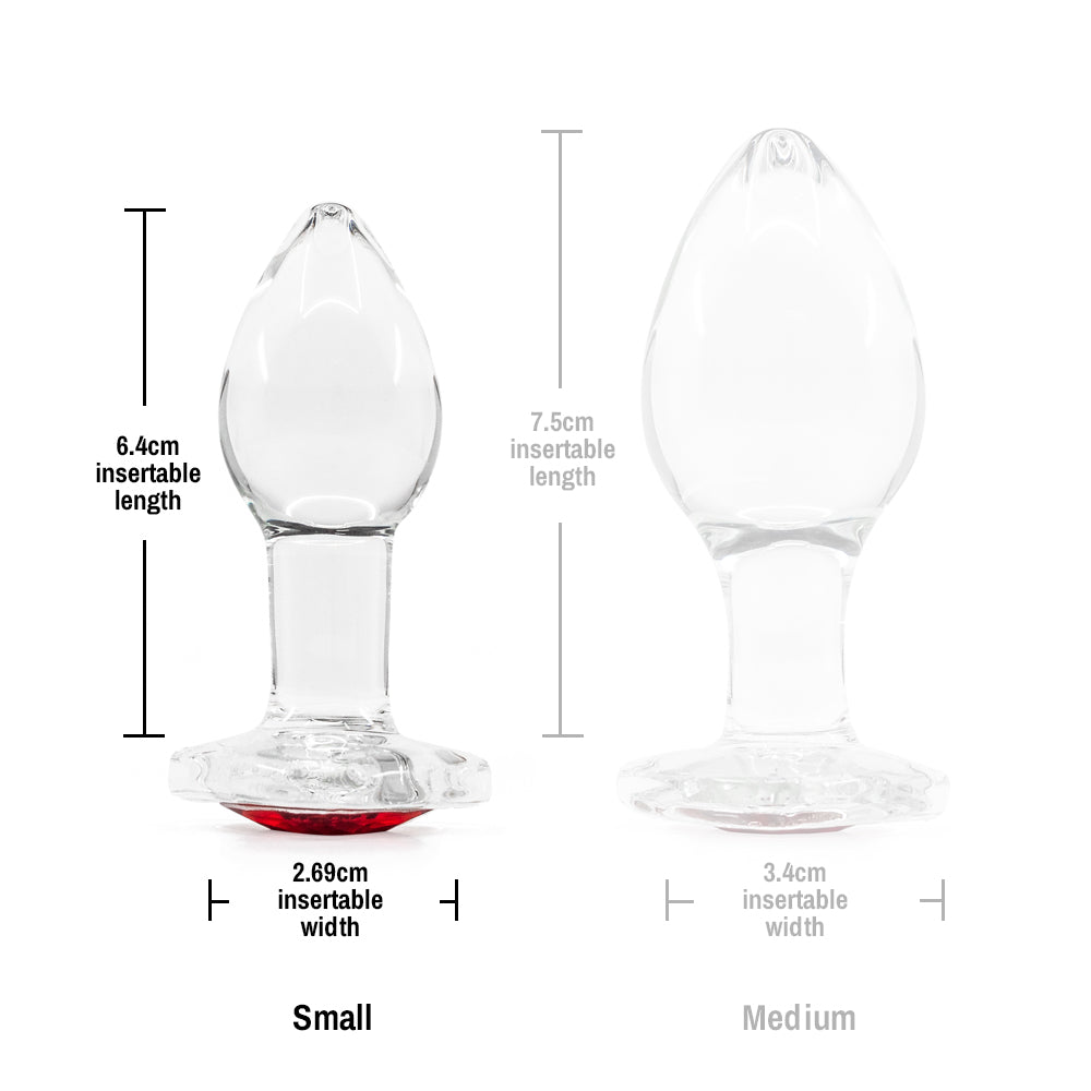 Crystal Desires Glass Butt Plug With Heart Gem - Small has a red heart-shaped gem base to make your butt look glamorous! Compatible w/ all lubricants & temperature play. Size chart.