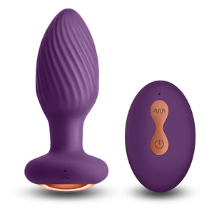 Inya Alpine Vibrating Gyrating Remote Control Butt Plug has an innovative gyrating motor to rotate & vibrate inside you while the ribbed texture massages your inner walls. Purple.