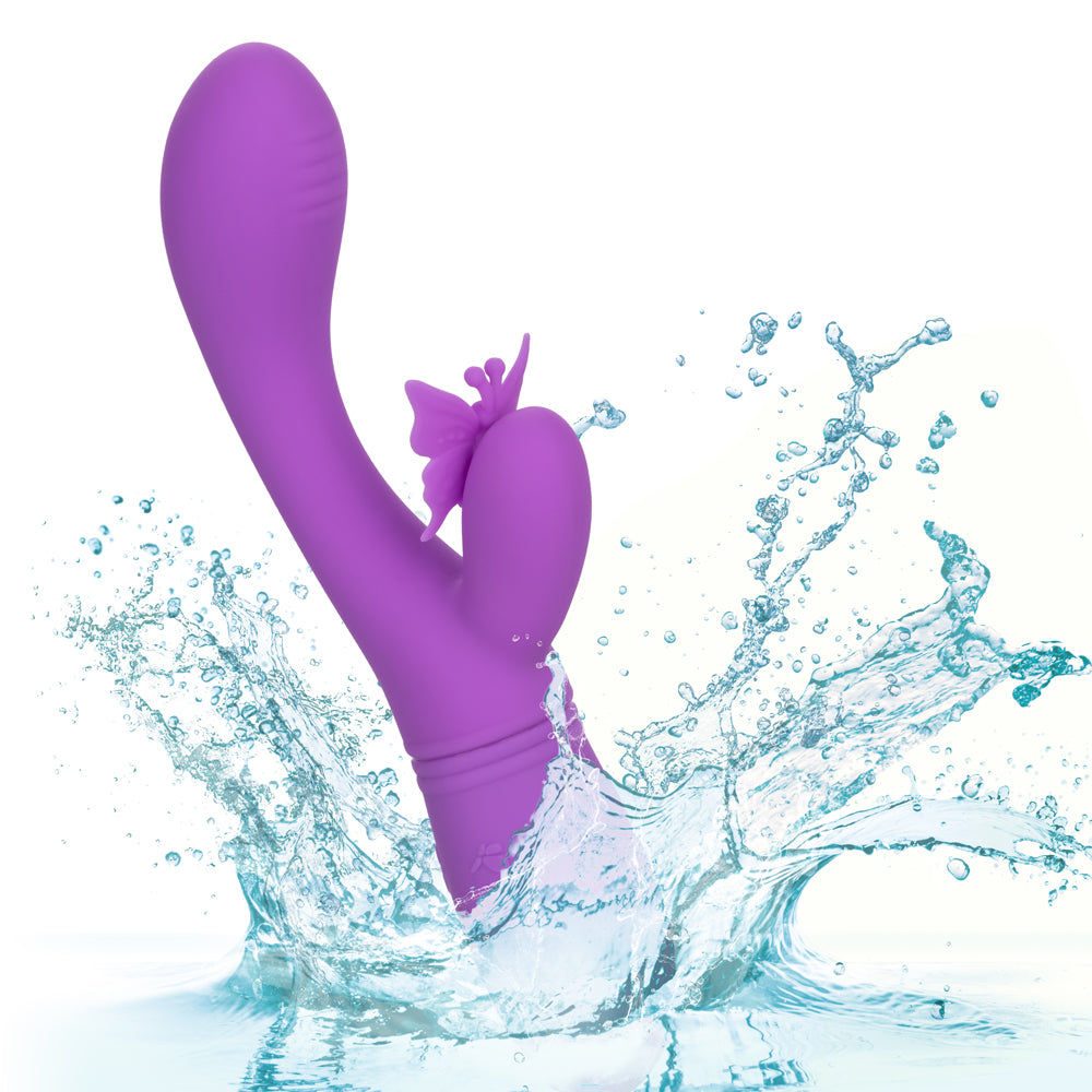 Rechargeable Butterfly Kiss Flutter Rabbit Vibrator has a ribbed G-spot head + a butterfly-shaped clitoral pleaser that flutters its wing & antennae over your clitoris in 10 modes! Purple. Waterproof.