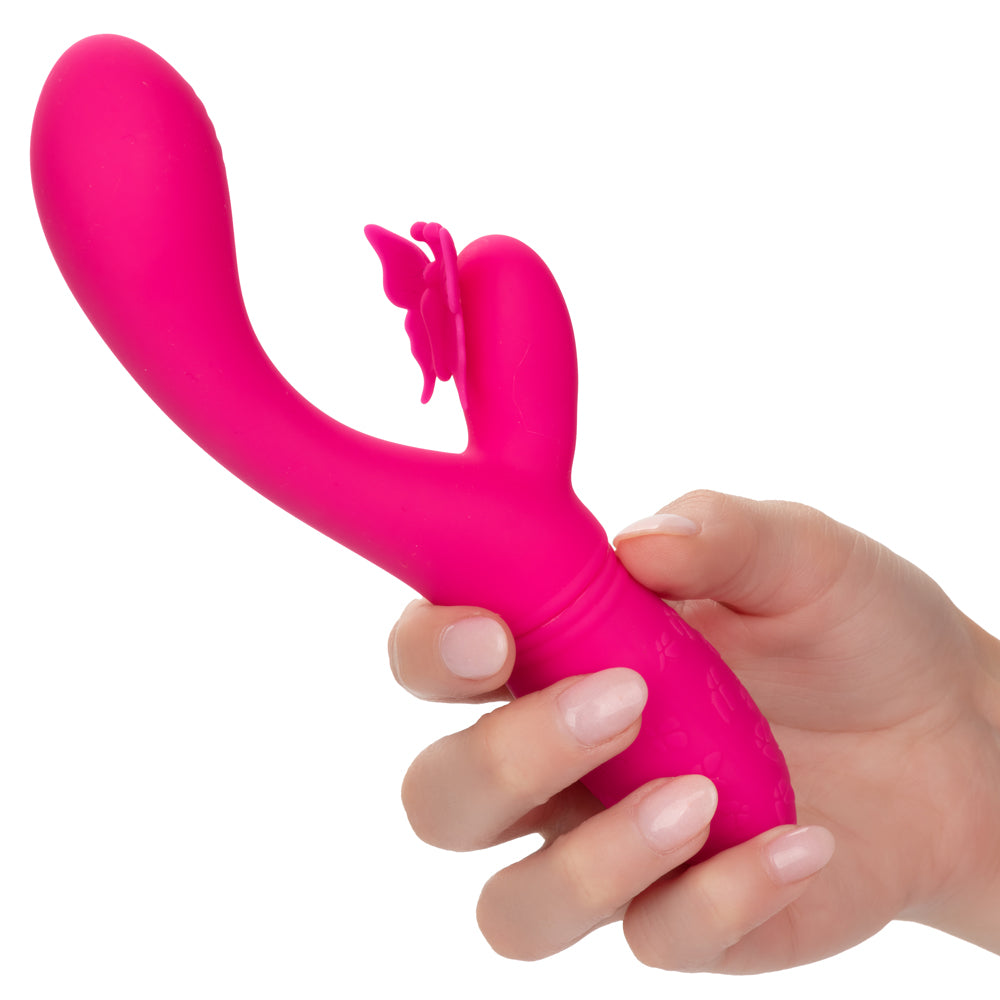 Rechargeable Butterfly Kiss Flutter Rabbit Vibrator has a ribbed G-spot head + a butterfly-shaped clitoral pleaser that flutters its wing & antennae over your clitoris in 10 modes! Pink. On-hand.