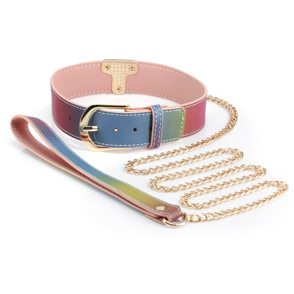 Spectra Bondage Rainbow Faux Leather Collar & Chain Leash includes a metal chain leash & a faux leather collar in a rainbow gradient w/ gorgeous gold hardware.
