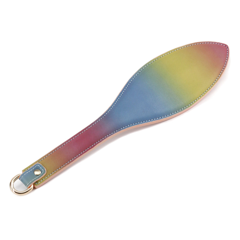  Spectra Bondage Rainbow Faux Leather Spanking Paddle comes in a rainbow gradient of vegan-friendly leather that looks great while still or moving.