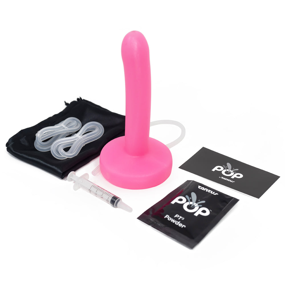 Tantus Pop 6" Slim Squirting Silicone Dildo has a sleek, slim design & a removable inner tubing system for easy cleaning to ensure a hygienic experience. Watermelon pink. Accessories.