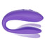 The We-Vibe Sync Go Couples Vibrator demonstrates its adjustable C-shape design with its flexible tail.