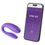 The We-Vibe Sync Go App-Compatible Couples Vibrator sits next to a smartphone displaying the We-Connect™ app on its screen.