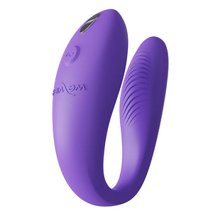 A right-side view of a purple We-Vibe Sync Go Couples Vibrator shows the ribbed texture on the G-spot arm.