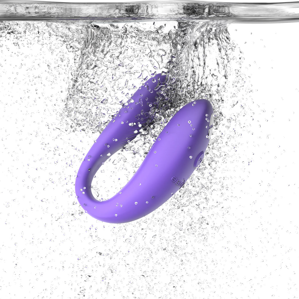 The We-Vibe Sync Go falls into clear water, showing its waterproof silicone design.
