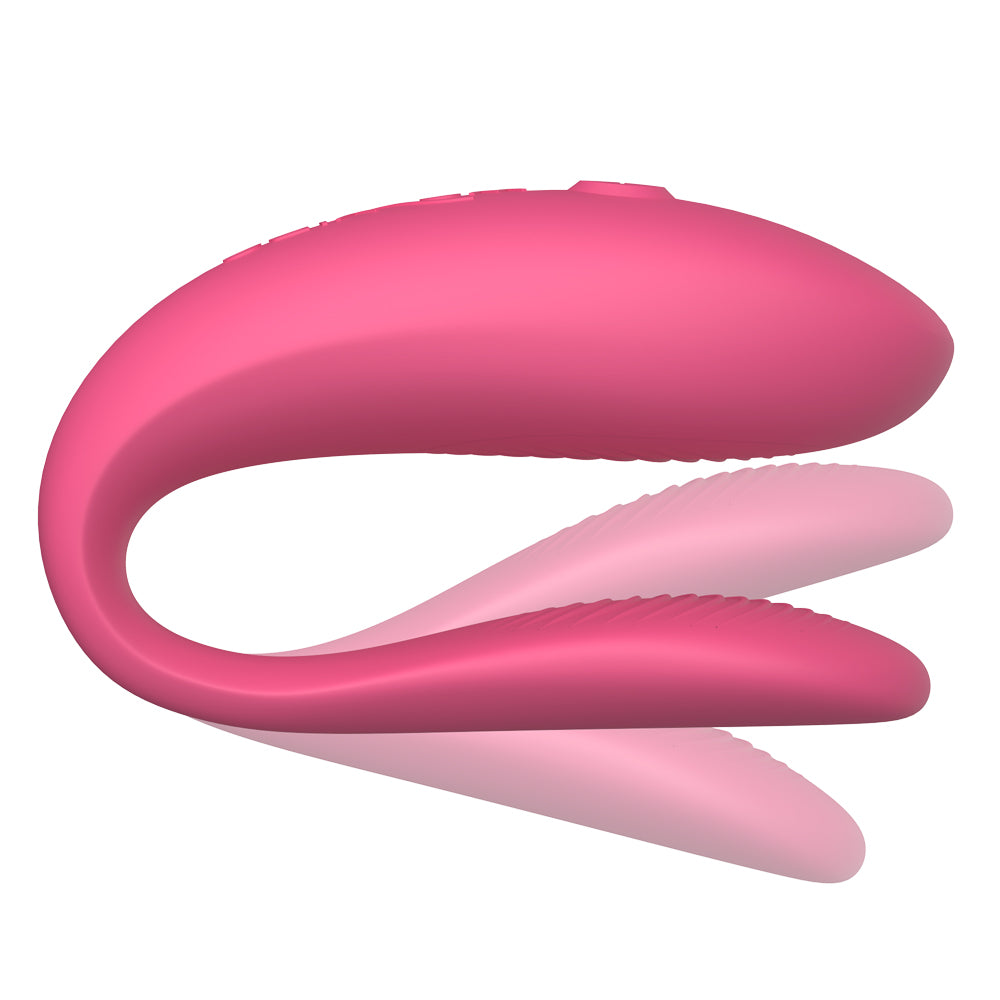 We-Vibe Sync Lite App-Compatible Couples Vibrator has 10 tantalising vibration modes packed into an adjustable C-shaped body & is app-compatible for more ways to play. Pink. Adjustable.