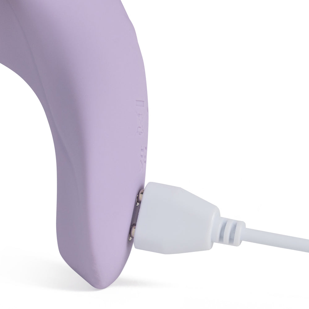 Clos-up of Winyi's My Love panty vibrator showing its magnetic charging cable attached.
