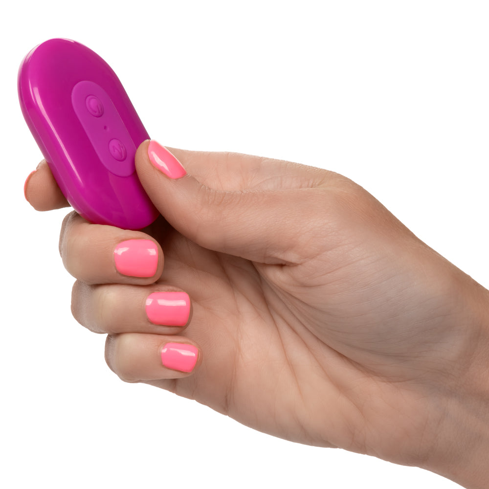 Slay™ - #SpinMe - remote control textured toy has 10 vibration & rotation modes to stimulate your insides like never before. Waterproof & rechargeable for your convenience. Pink, remote control in hand for size comparison
