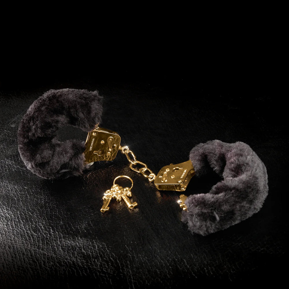  Fetish Fantasy Gold Deluxe Furry Cuffs are covered in soft black faux fur for restraint play that's as stylish as it is functional. (3)