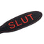 Grain Leather Slut Cutout Paddle has the word SLUT hand-cut into one side in bold contrast red. (2)