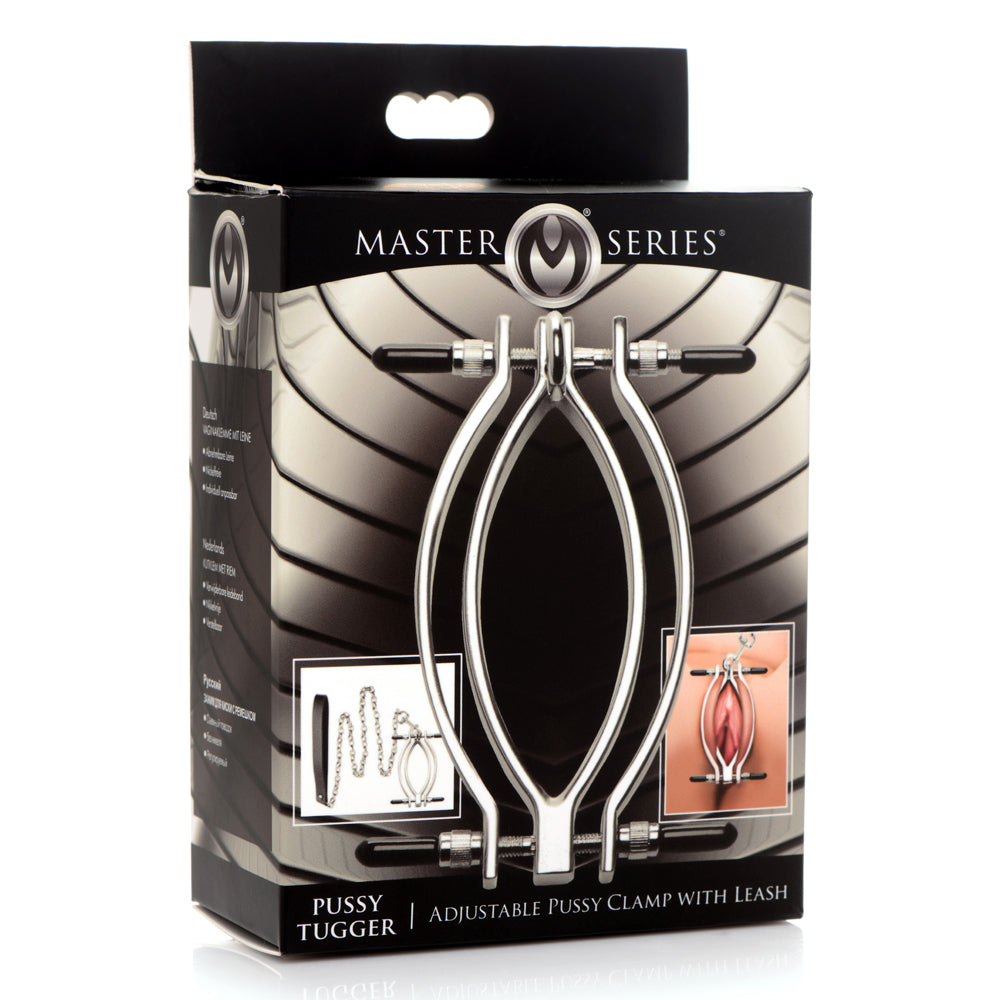 Master Series Pussy Tugger Adjustable Pussy Clamp adjusts to put the perfect amount of pressure on your sub's labia & includes a leash for pulling the clamp to stimulate the wearer. Package.