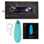 Nu Sensuelle electric blue clitoral suction and licking vibrator sits next to charging cord and packaging. 