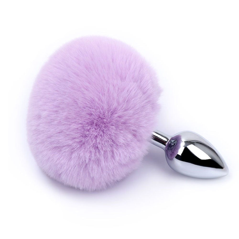 Rabbit Tail Metal Butt Plug has a cute fluffy bunny tail w/ a tapered tip for comfortable insertion & a seamless finish that's compatible w/ all lubricants. Light purple.