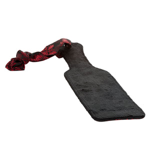 Scandal Double-Sided Spanking Paddle is double-sided for distinct sensations w/ red & black brocade fabric on one side & soft velvet on the other. (3)