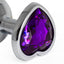  Seamless Metal Butt Plug With Heart Gem has a heart-shaped gem base that makes your butt look cute & glamorous while the material holds heat/cold for temperature play. Dark purple.