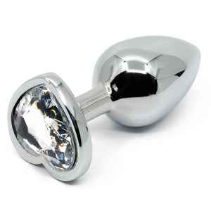  Seamless Metal Butt Plug With Heart Gem features a heart-shaped gem base that makes your booty look cute & glamorous! Also holds heat & cold for temperature play. Clear.