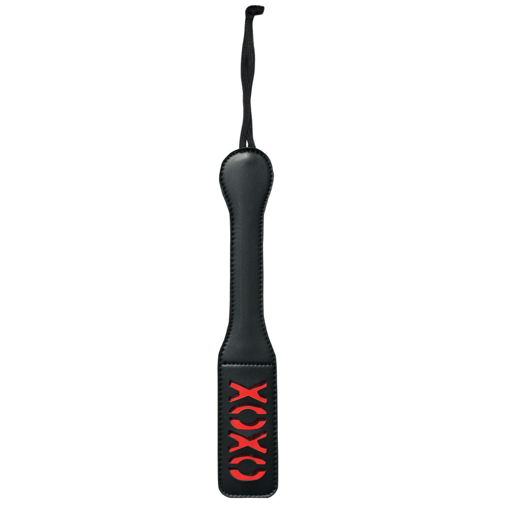 Sex & Mischief XOXO Imprint Spanking Paddle sports an XOXO cutout design to leave an impression of your love on your sub's skin. Black.