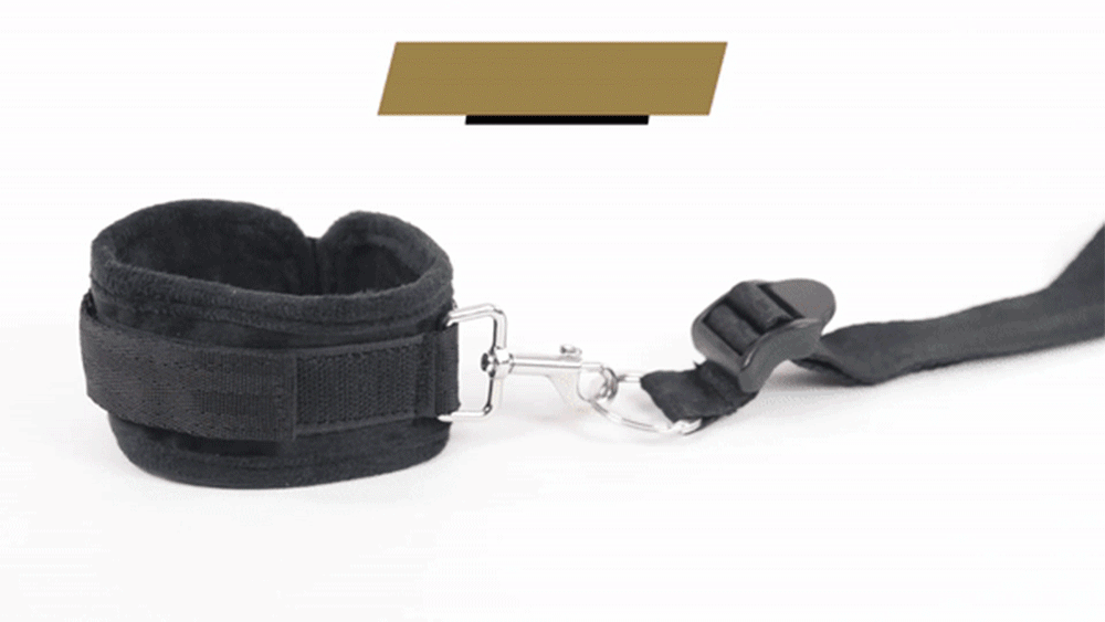Sportsheets Under The Bed Restraint System includes 4 Velcro cuffs, 4 restraint straps & a connector strap that adjust to fit any mattress. GIF. (3)
