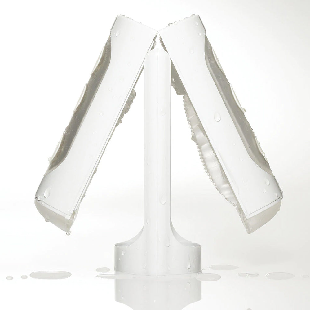 Blanket yourself in soft bliss with the world's first flip-open reusable masturbator, which is easier to lubricate & clean than ever. Built-in drying stand.